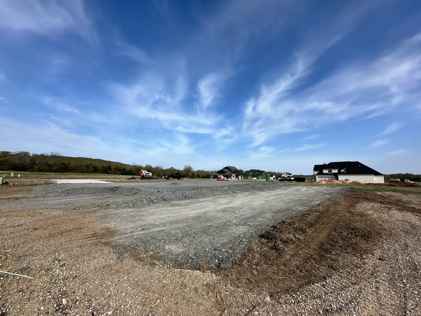 Wide graded site prepared near a residential neighborhood