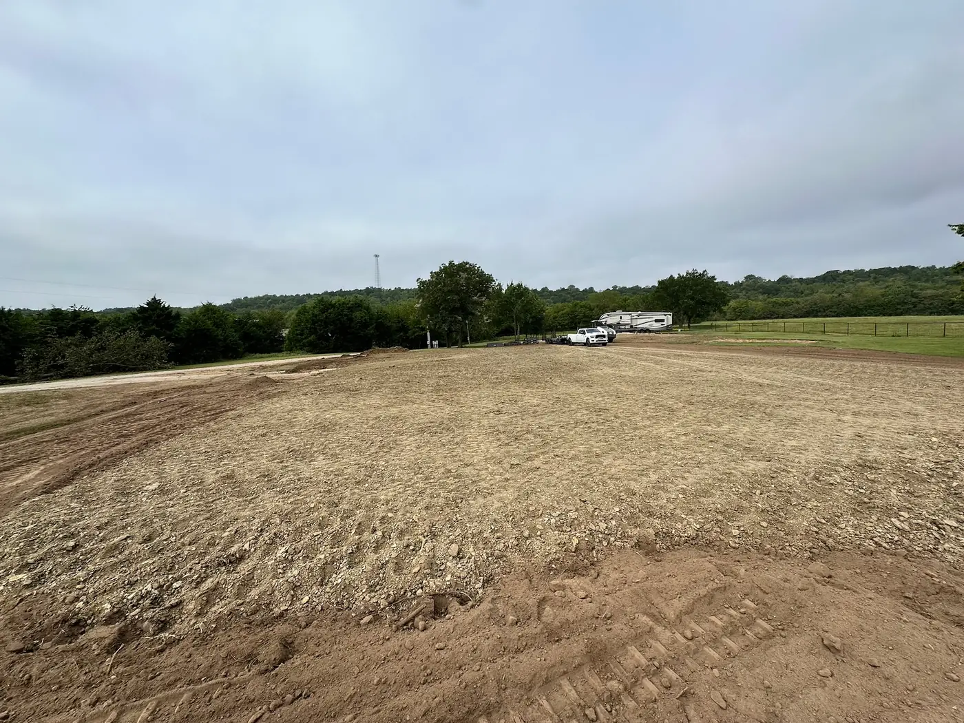 Broad finished grade across a cleared property