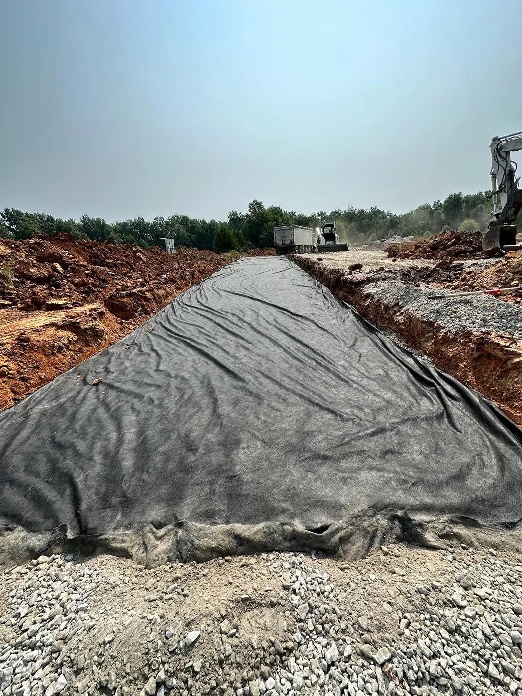 Geotextile-lined driveway and access base under construction