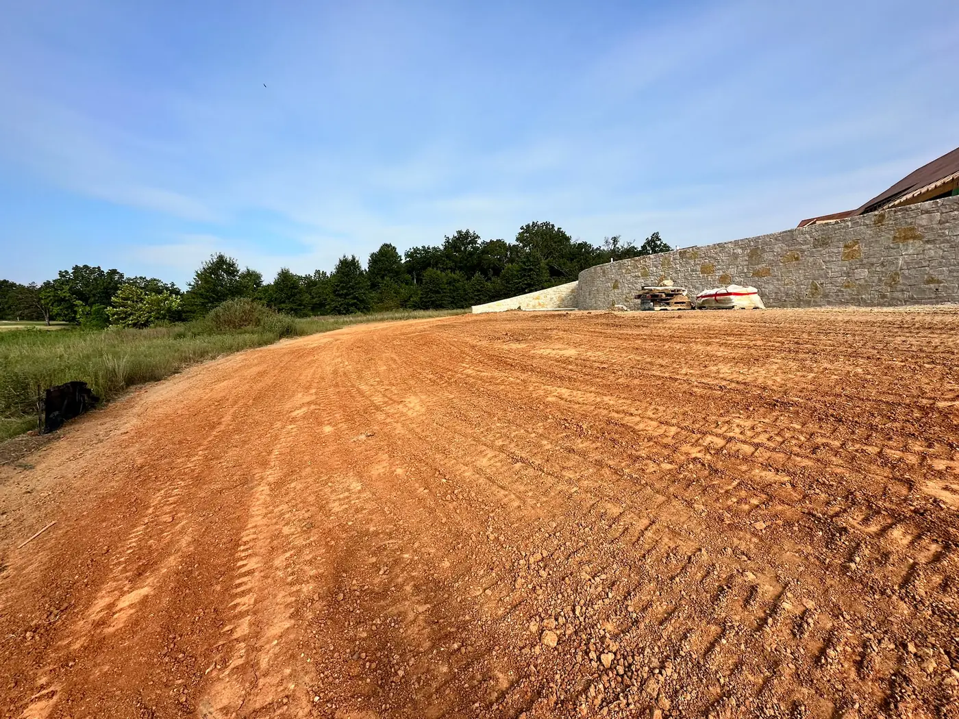 Smooth final grade beside a residential retaining wall