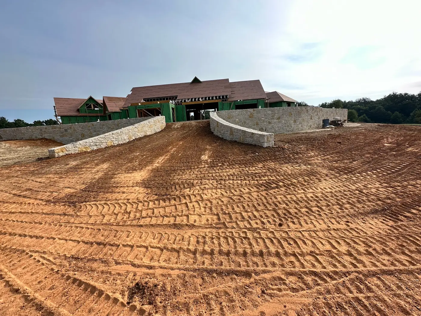Residential grading in front of a large new home