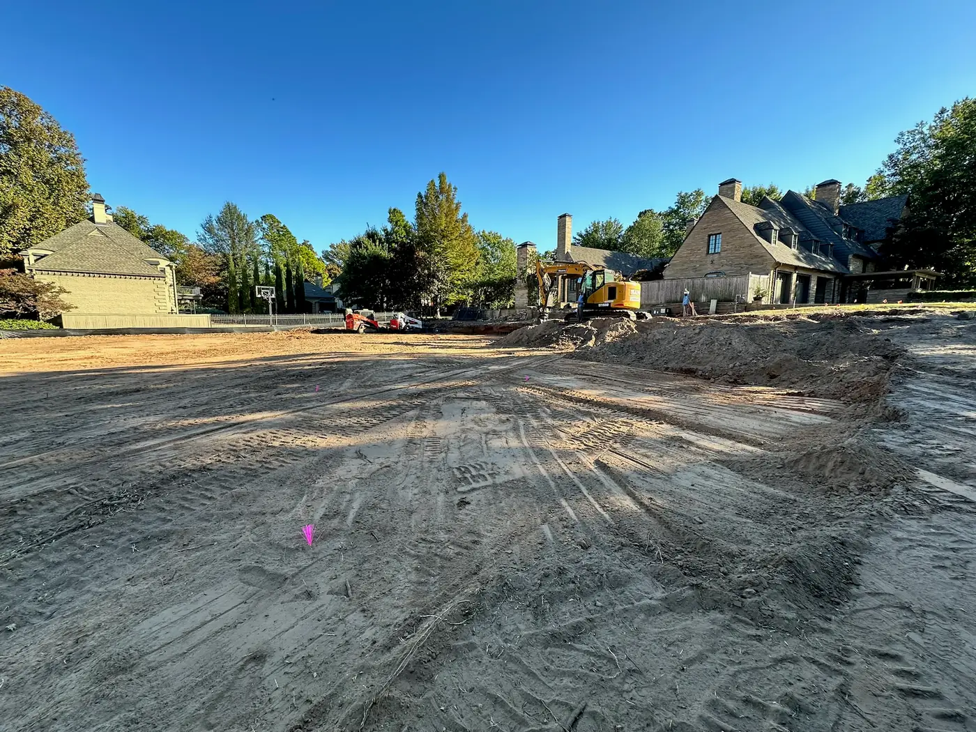 Excavator preparing a residential construction site