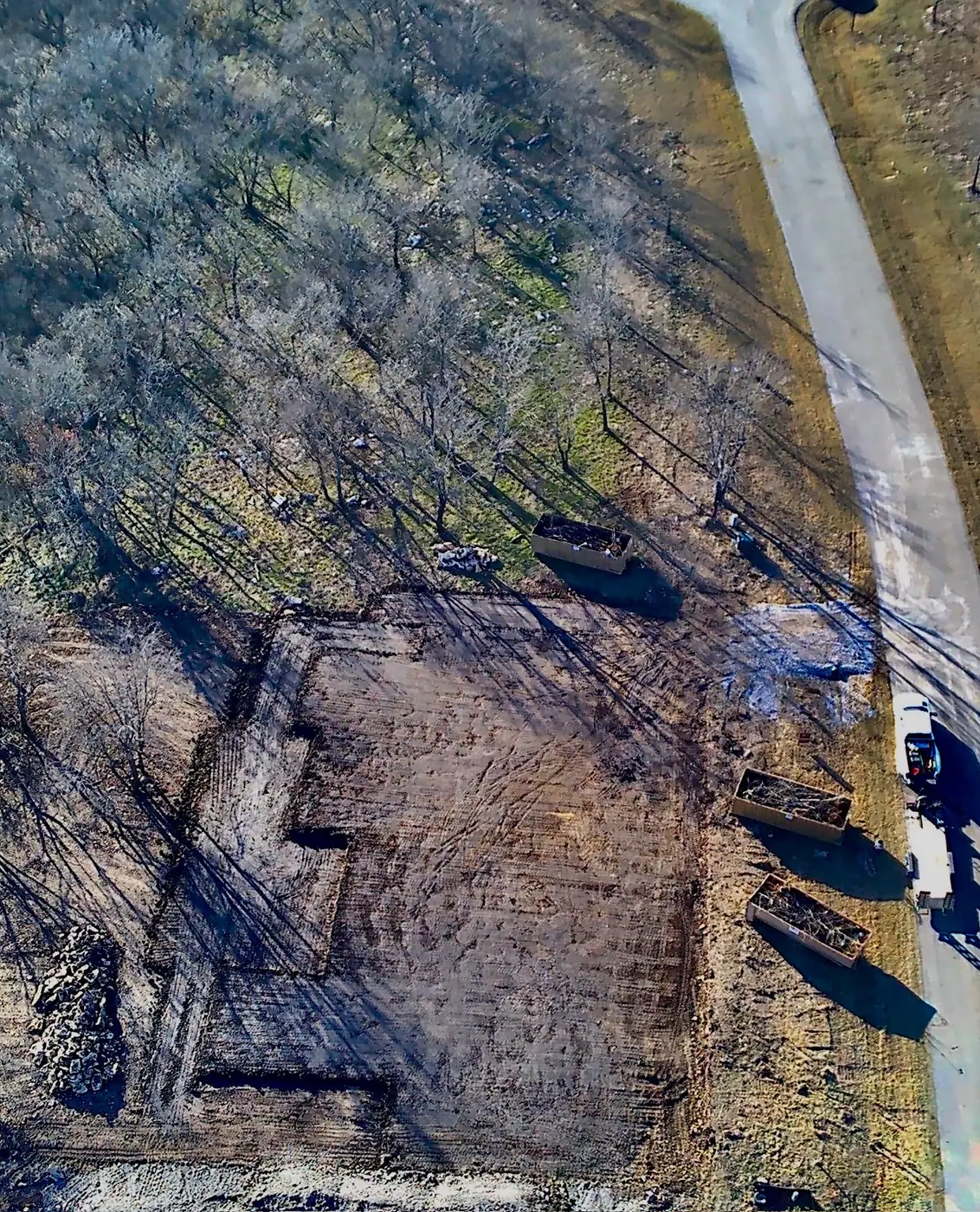 Vertical aerial view of a cleared residential property