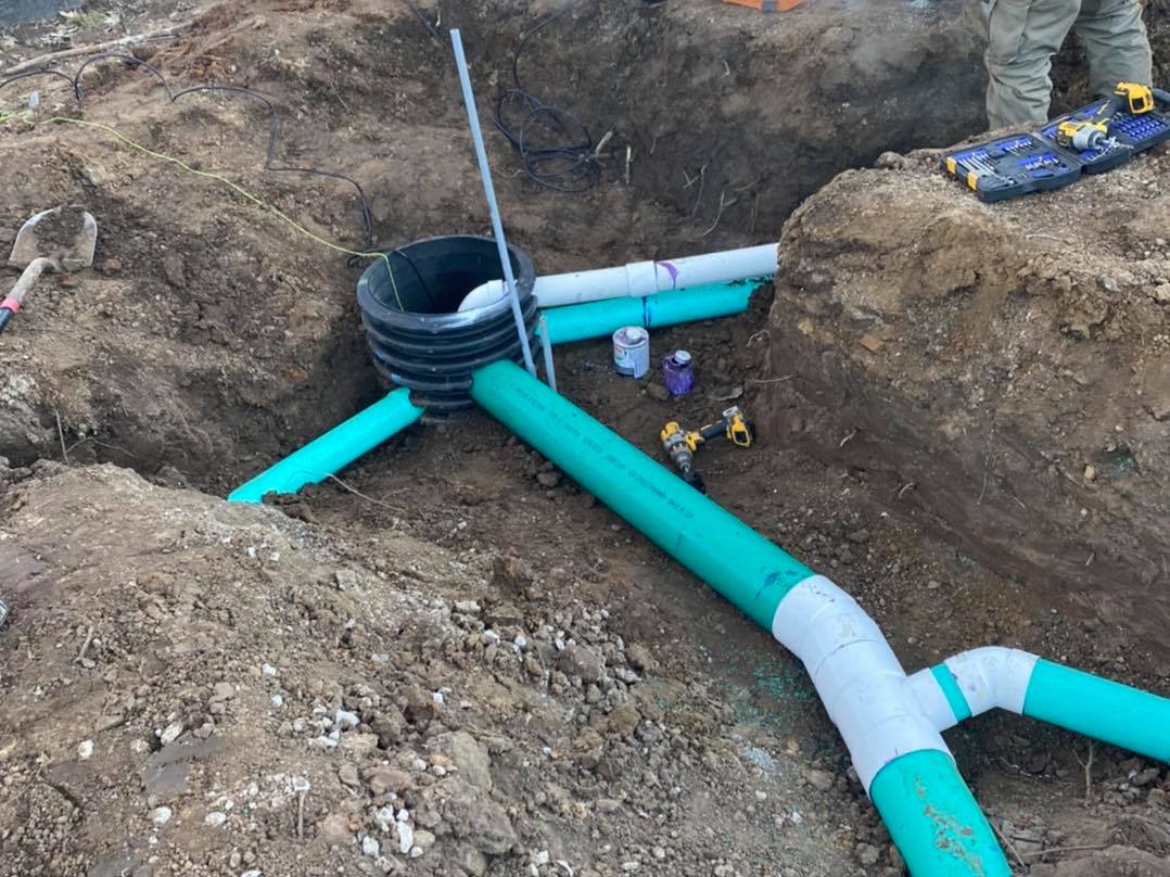 Underground utility lines installed in a prepared excavation